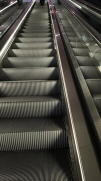 AMSTERDAM, NETHERLANDS - MAY 8 2026: People on the Escalator inside Rokin Metro Station