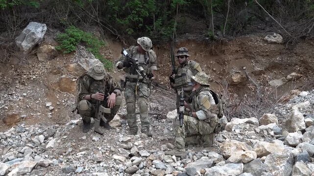 Soldiers conduct operations in rocky terrain during training exercise in remote area