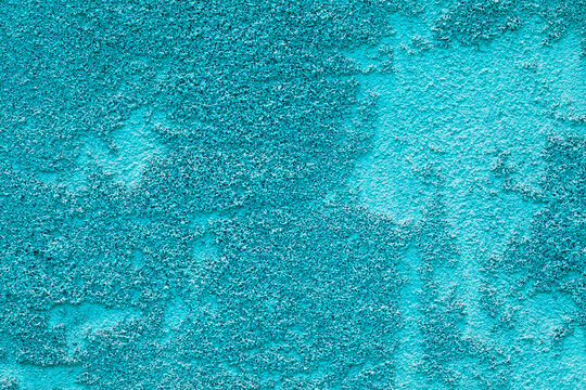 Rough mint blue concrete stucco wall texture background