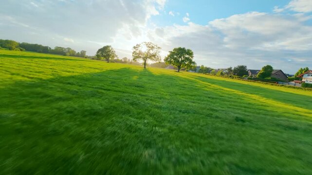 FPV drone flight through a rural field