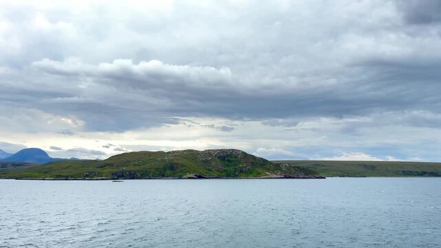Scenic footage capturing the wild beauty and isolation of Scotland's Western Isles off the coast of Ullapool on an overcast day.