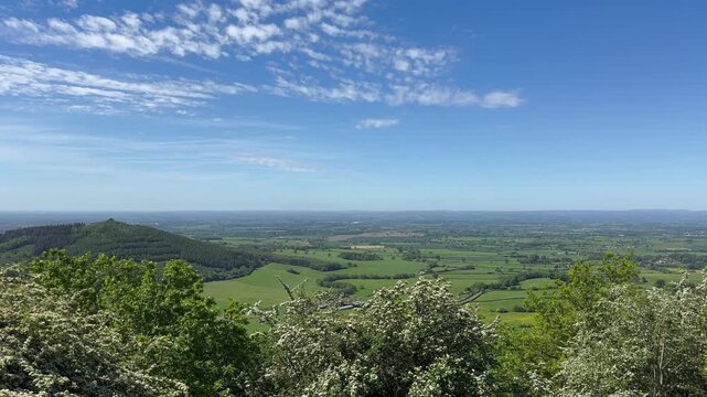 Sutton Bank Finest View in England viewpoint in Northern England over North Yorkshire countryside beneath a blue sky.