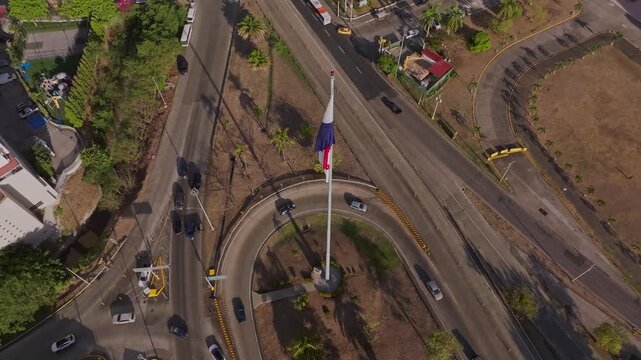 Aerial drone shot pointing towards the Panamanian flag, the shot ends pointing directly downwards
