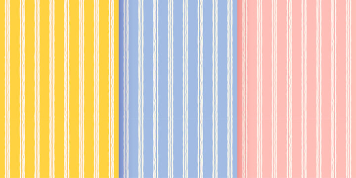 Abstract irregular striped seamless pattern background set. Blue, pink and yellow hand drawn vertical wavy lines. Simple geometric print for textile, wallpaper and wrapping paper. Vector illustration