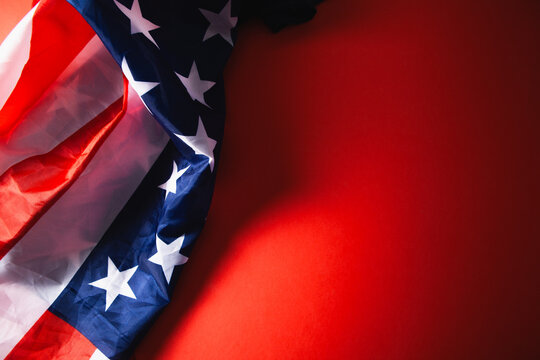 American flag on red background, top view. Memorial day celebration concept