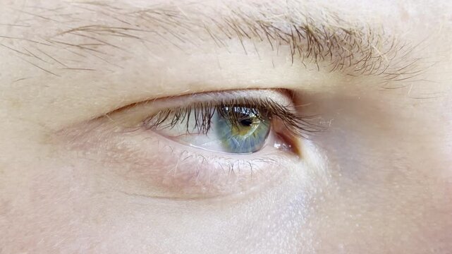 Close-up of a young man's open eye