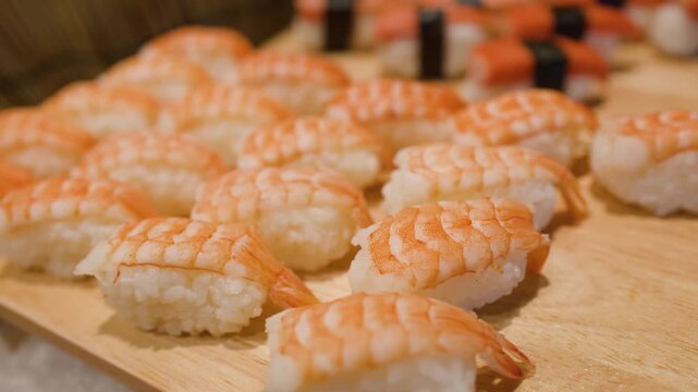 Fresh Shrimp Nigiri and Tamago Sushi Selection on Buffet Display