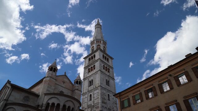Modena, Italy, Ghirlandina (Garland) tower, Unesco monument, Piazza Grande (Big Square), tower bell of the city, video time lapse effect
