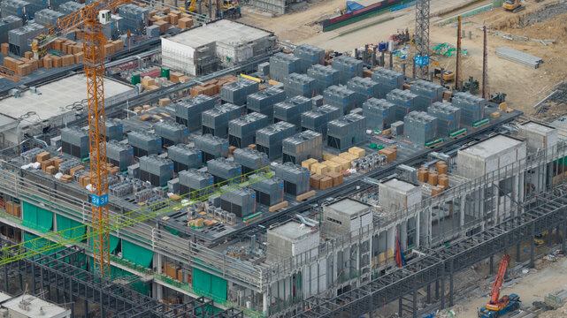 Aerial drone view of a massive hyperscale data center under construction in Chonburi, Thailand, showing cloud infrastructure, AI computing and industrial scale digital growth.
