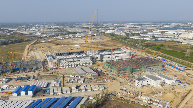 Aerial drone view of a massive hyperscale data center under construction in Chonburi, Thailand, showing cloud infrastructure, AI computing and industrial scale digital growth.
