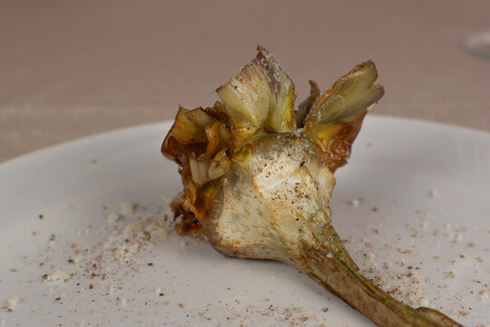 Roasted Artichoke Heart on White Plate with Seasoning