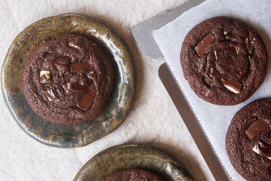 Top view of a double chocolate mint cookie on a ceramic plate.