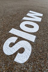 Fototapeta premium Slow down road sign warning for cautious driving