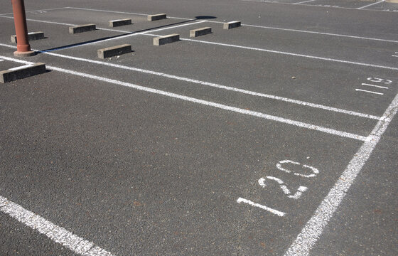 Ooutdoor parking lot with numbered spaces and white lines.（駐車場）3