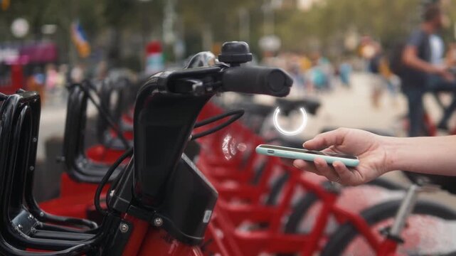 Unlocking a Bike Using a Smartphone in a City Park Smart Mobility and Bike Sharing Concept