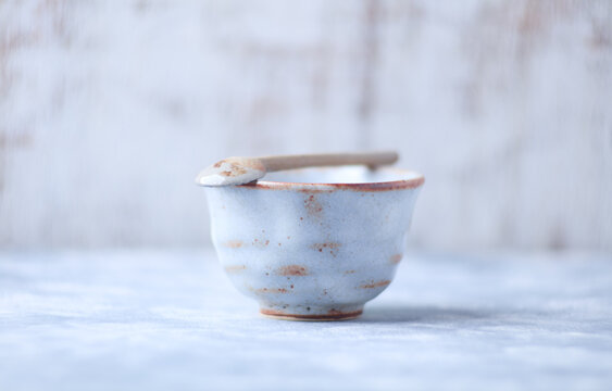 Traditional japanese ceramic on rustic wooden background. Soft focus. Copy space.