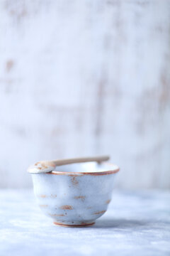 Traditional japanese ceramic on rustic wooden background. Soft focus. Copy space.