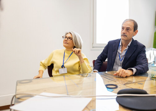 Colleagues listening during a manufacturing industry meeting