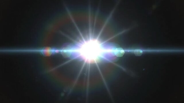 A bright white light source creates a circular rainbow lens flare effect