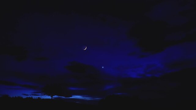 Crescent Moon, planet conjunction and landscape scenery silhouettes. Real-time twinkling stars.