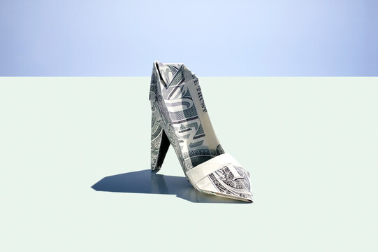Origami high heel shoe made of a folded one dollar note