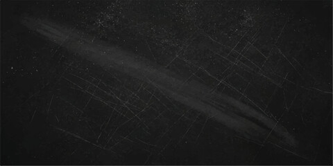 A textured dark chalkboard with faint chalk marks and visible scratches creates a background for writing, evoking a sense of old school education or creative thought. © Queality Full