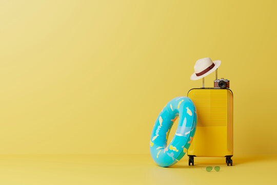 Yellow suitcase with summer travel gear on yellow background