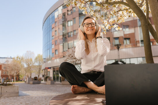 Smiling businesswoman enjoying work life balance outdoors