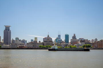 The Bund Historic Skyline and Cargo Ship on the Huangpu River in Shanghai © Plamen Petrov