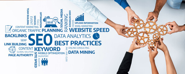 Obraz premium A team collaborates over a table, focusing on data analytics and SEO best practices, aiming to enhance online marketing strategies and improve overall digital performance. Amity