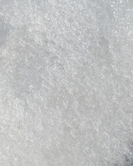 Fototapeta premium Vertical abstract macro texture of white winter snow