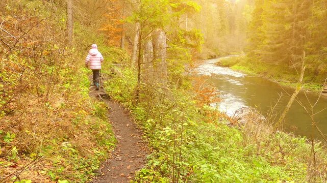 Little beautiful girl walks in Slovak Paradise. Slovak Paradise (Slovensky raj) is mountain range in eastern Slovakia, part of Spis-Gemer Karst, located between towns of Spisska Nova Ves and Dobsina.