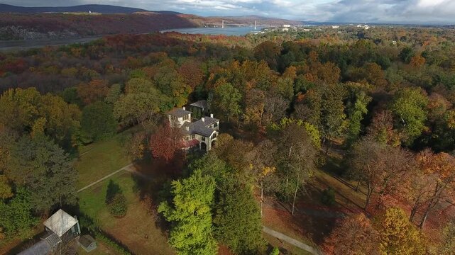 Aerial view of the Locust Grove Historic Site and Samuel F. B. Morse house surrounded by vibrant autumn foliage near the Hudson River in Poughkeepsie, New York, United States.