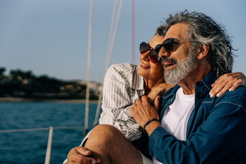 Senior couple enjoying sailing, luxury life, active retirement