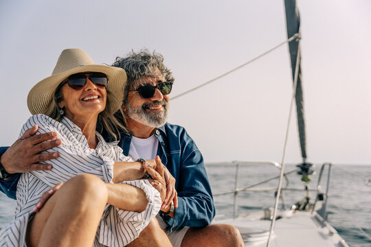 Senior couple enjoying luxury sailing vacation on a yacht