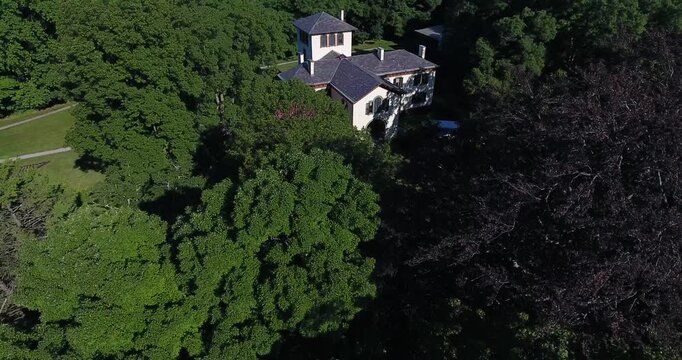 Aerial view of the dense green tree canopy and summer foliage at the Locust Grove Historic Site Poughkeepsie, New York, United States.