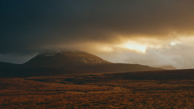 sunset over the mountains in the scottish highlands