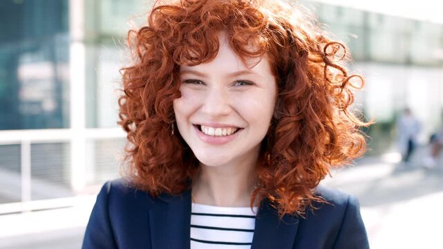 Funny, face and professional with business woman in city for about us, property developer or pride. Real estate agent, red head or urban investor with person laughing outdoor for confidence in career