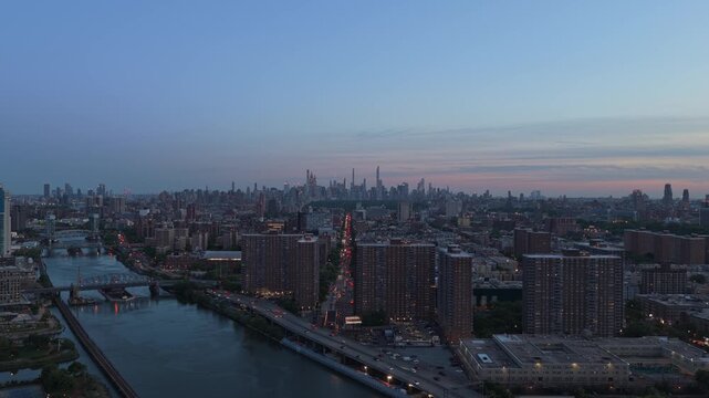 South Bronx revealing Harlem River and Upper Manhattan skyline with urban traffic flowing on bridges and Major Deegan Expressway in New York City