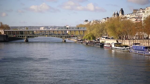 Paris metro line 6 train crossing the Bir Hakeim bridge over the Seine River
