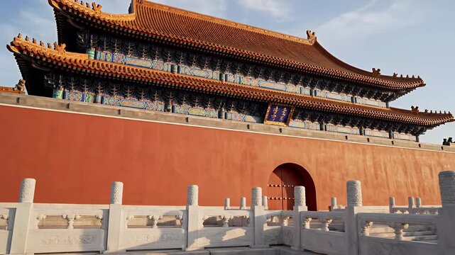Majestic red wall building with ornate tiled roof and stone railing