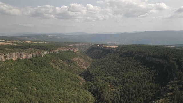 4K 10-bit drone shot flying forward through the deep rocky valley of Tokatli Canyon in Safranbolu, Turkey