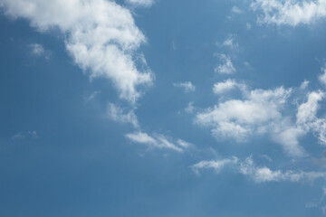 Fototapeta premium Blue Sky with Scattered White Clouds