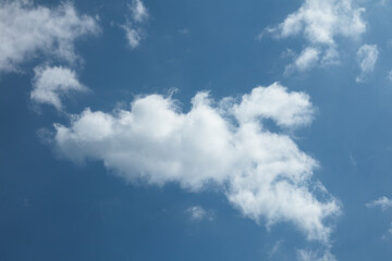 Obraz premium Fluffy Clouds on a Clear Blue Sky