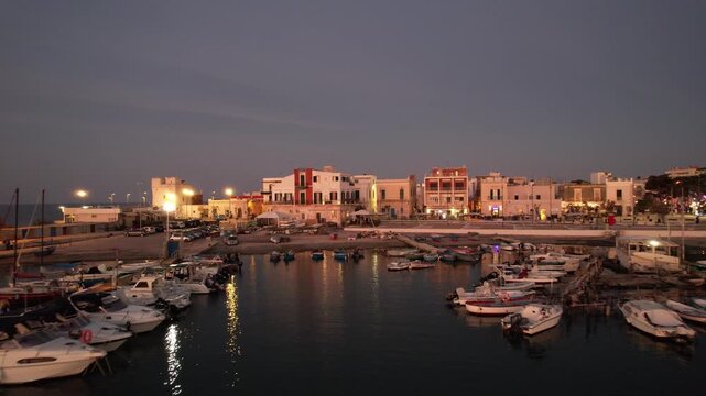 Santo Spirito-Catino-San Pio - rising aerial view in the port at dusk over the houses