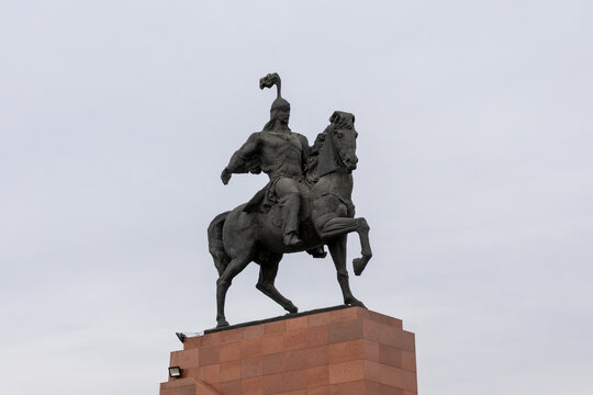 Bishkek, Kyrgyzstan - February 23, 2025: Equestrian monument of Manas the Noble rising above Ala-Too Square in Bishkek, Kyrgyzstan, captured against an overcast sky with ample copy space