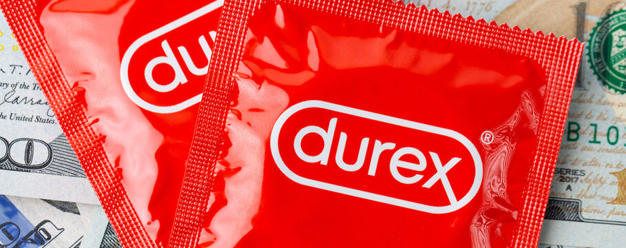 An image of a red Durex condom package along with dollar bills.