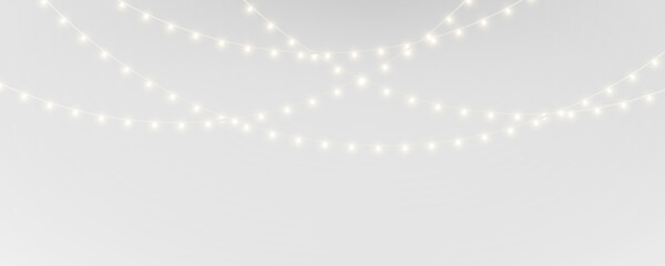 Festive Christmas PNG lights design. Golden glowing bulbs garland. Great for winter ads banners and holiday compositions. © dedstock