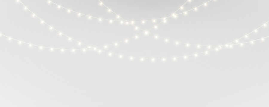Festive Christmas PNG lights design. Golden glowing bulbs garland. Great for winter ads banners and holiday compositions.