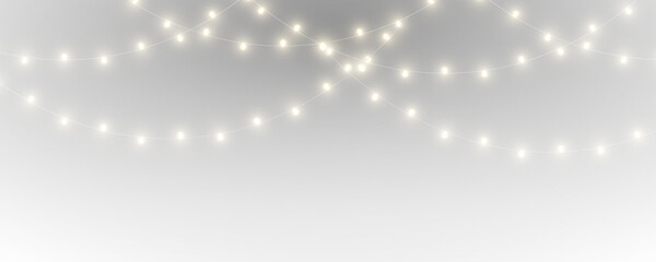 Bright Christmas garland glows with realistic light effects. Elegant hanging bulbs enrich winter celebration themes. Transparent background PNG. © dedstock
